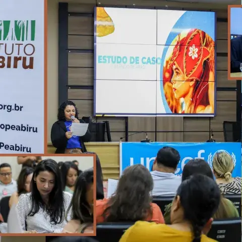 Grupo de pessoas assiste a palestrante