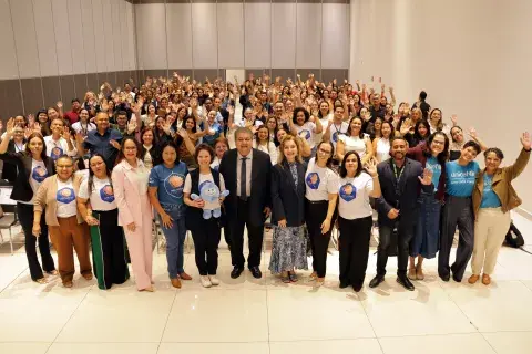 Foto das equipes no auditório