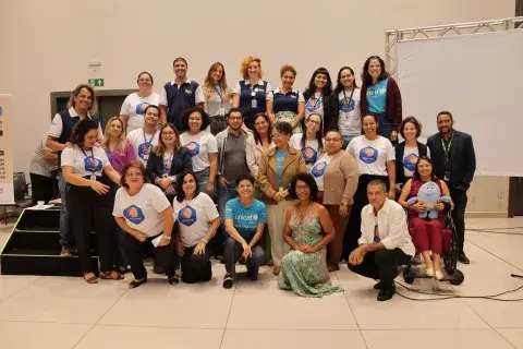Foto das equipes no auditório